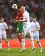 11 June 2024; Will Smallbone of Republic of Ireland in action against Joao Neves of Portugal during the international friendly match between Portugal and Republic of Ireland at Estádio Municipal de Aveiro in Aveiro, Portugal. Photo by Stephen McCarthy/Sportsfile