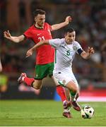 11 June 2024; Josh Cullen of Republic of Ireland in action against Diogo Jota of Portugal during the international friendly match between Portugal and Republic of Ireland at Estádio Municipal de Aveiro in Aveiro, Portugal. Photo by Stephen McCarthy/Sportsfile