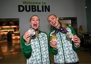 13 June 2024; Irish athletes Sophie Becker, left, with her silver medal and Sharlene Mawdsley with her gold and silver medals at Dublin Airport on their return home from the European Athletics Championships in Rome, Italy. Photo by David Fitzgerald/Sportsfile