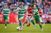 13 June 2024; Mason Melia of St Patrick's Athletic in action against Lee Grace of Shamrock Rovers during the SSE Airtricity Men's Premier Division match between St Patrick's Athletic and Shamrock Rovers at Richmond Park in Dublin. Photo by Seb Daly/Sportsfile