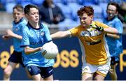 14 June 2024; Luke McGill of Dublin is tackled by Ethan Irvine of Antrim during the friendship games between Dublin Cumann na mBunscol and Antrim Cumann na mBunscol at Parnell Park in Dublin. Photo by Shauna Clinton/Sportsfile