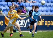 14 June 2024; Killian Woods of Dublin in action against Ethan Irvine of Antrim during the friendship games between Dublin Cumann na mBunscol and Antrim Cumann na mBunscol at Parnell Park in Dublin. Photo by Shauna Clinton/Sportsfile