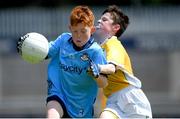 14 June 2024; Dylan Keogh of Dublin is tackled by Ronan McKenna of Antrim during the friendship games between Dublin Cumann na mBunscol and Antrim Cumann na mBunscol at Parnell Park in Dublin. Photo by Shauna Clinton/Sportsfile