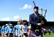 14 June 2024; A bagpipe player leads the teams out before the friendship games between Dublin Cumann na mBunscol and Antrim Cumann na mBunscol at Parnell Park in Dublin. Photo by Shauna Clinton/Sportsfile