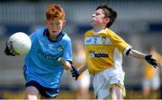 14 June 2024; Dylan Keogh of Dublin is tackled by Ronan McKenna of Antrim during the friendship games between Dublin Cumann na mBunscol and Antrim Cumann na mBunscol at Parnell Park in Dublin. Photo by Shauna Clinton/Sportsfile