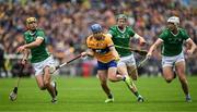 9 June 2024; Shane O'Donnell of Clare in action against Limerick players, from left, Dan Morrissey, Will O'Donoghue and Kyle Hayes during the Munster GAA Hurling Senior Championship final match between Clare and Limerick at FBD Semple Stadium in Thurles, Tipperary. Photo by Brendan Moran/Sportsfile