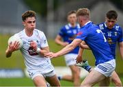 15 June 2024; Ruaidhrí Lawlor of Kildare in action against Andrew Hill of Cavan during the Electric Ireland GAA Football All-Ireland Minor Championship Tier 2 final match between Cavan and Kildare at Páirc Tailteann in Navan, Meath. Photo by Tyler Miller/Sportsfile
