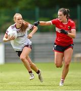 15 June 2024; Olivia Divilly of Galway in action against Sadbh McGoldrick of Cork during the TG4 All-Ireland Ladies Football Senior Championship Round 2 match between Cork and Galway at MTU Cork in Cork. Photo by David Fitzgerald/Sportsfile