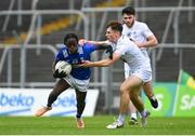 15 June 2024; Joshua Shehu of Cavan in action against Cian Cahill of Kildare during the Electric Ireland GAA Football All-Ireland Minor Championship Tier 2 final match between Cavan and Kildare at Páirc Tailteann in Navan, Meath. Photo by Tyler Miller/Sportsfile