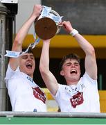 15 June 2024; Kildare joint captains, Evan Boyle, left, and Ruaidhrí Lawlor lift the trophy after the Electric Ireland GAA Football All-Ireland Minor Championship Tier 2 final match between Cavan and Kildare at Páirc Tailteann in Navan, Meath. Photo by Tyler Miller/Sportsfile