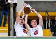 15 June 2024; Kildare joint captains, Evan Boyle, left, and Ruaidhrí Lawlor lift the trophy after the Electric Ireland GAA Football All-Ireland Minor Championship Tier 2 final match between Cavan and Kildare at Páirc Tailteann in Navan, Meath. Photo by Tyler Miller/Sportsfile
