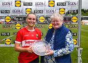 15 June 2024; National Treasurer Geraldine Carey presents the player of the match award to Laura O'Mahony of Cork after the TG4 All-Ireland Ladies Football Senior Championship Round 2 match between Cork and Galway at MTU Cork in Cork. Photo by David Fitzgerald/Sportsfile