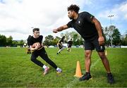 15 June 2024; Steelers tight end Connor Heyward and participants at the Pittsburgh Steelers Youth Camp which was held today at Deramore Park in Belfast. The event featured over 100 young American footballers across various age ranges in attendance, where they received real time coaching and instruction from the Steelers and American Football Ireland. The Steelers hosted this event as initiative is part of the NFL’s Global Markets Programme, as the NFL team plans to expand their fanbase and grow the knowledge and love of American Football in both the Republic of Ireland and Northern Ireland. For further information and to see highlights of the event, visit Steelers Ireland social media accounts - @SteelersIreland. Photo by Ramsey Cardy/Sportsfile