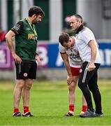 15 June 2024; Tyrone joint-manager Brian Dooher, right, and coach Joe McMahon, left, with Kieran McGeary before the GAA Football All-Ireland Senior Championship Round 3 match between Cork and Tyrone at Glenisk O'Connor Park in Tullamore, Offaly. Photo by Piaras Ó Mídheach/Sportsfile