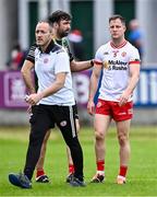 15 June 2024; Kieran McGeary of Tyrone with Tyrone joint-manager Brian Dooher, left, and coach Joe McMahon before the GAA Football All-Ireland Senior Championship Round 3 match between Cork and Tyrone at Glenisk O'Connor Park in Tullamore, Offaly. Photo by Piaras Ó Mídheach/Sportsfile