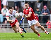 15 June 2024; Niall Devlin of Tyrone in action against Seán Powter of Cork during the GAA Football All-Ireland Senior Championship Round 3 match between Cork and Tyrone at Glenisk O'Connor Park in Tullamore, Offaly. Photo by Piaras Ó Mídheach/Sportsfile