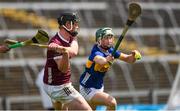 15 June 2024; Cillian Roche of Galway in action against Shane Ryan of Tipperary during the Electric Ireland GAA Hurling All-Ireland Minor Hurling Championship semi-final match between Tipperary and Galway at TUS Gaelic Grounds in Limerick. Photo by Tom Beary/Sportsfile