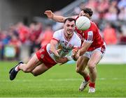 15 June 2024; Darragh Canavan of Tyrone in action against Daniel O' Mahony of Cork during the GAA Football All-Ireland Senior Championship Round 3 match between Cork and Tyrone at Glenisk O'Connor Park in Tullamore, Offaly. Photo by Piaras Ó Mídheach/Sportsfile