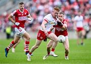 15 June 2024; Seán O’Donnell of Tyrone in action against Matty Taylor of Cork during the GAA Football All-Ireland Senior Championship Round 3 match between Cork and Tyrone at Glenisk O'Connor Park in Tullamore, Offaly. Photo by Piaras Ó Mídheach/Sportsfile