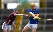 15 June 2024; Aaron Cagney of Tipperary in action against Brendan Fox of Galway during the Electric Ireland GAA Hurling All-Ireland Minor Hurling Championship semi-final match between Tipperary and Galway at TUS Gaelic Grounds in Limerick. Photo by Tom Beary/Sportsfile