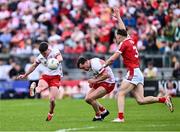 15 June 2024; Ruairí Canavan of Tyrone shoots, next to Darragh Canavan of Tyrone and Daniel O' Mahony of Cork, during the GAA Football All-Ireland Senior Championship Round 3 match between Cork and Tyrone at Glenisk O'Connor Park in Tullamore, Offaly. Photo by Piaras Ó Mídheach/Sportsfile