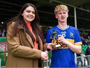 15 June 2024; Cillian Minogue of Tipperary is presented the Electric Ireland Player of the Match by Evelyn o’Keeffe of Electric Ireland after the Electric Ireland All-Ireland Minor Hurling Championship semi-final match between Tipperary and Galway at TUS Gaelic Grounds in Limerick. #ThisIsMajor. Photo by Tom Beary/Sportsfile