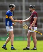 15 June 2024; Owen O'Dwyer of Tipperary shakes hands with Cillian Roche of Galway after the Electric Ireland GAA Hurling All-Ireland Minor Hurling Championship semi-final match between Tipperary and Galway at TUS Gaelic Grounds in Limerick. Photo by Tom Beary/Sportsfile