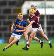 15 June 2024; Eoghan Doughan of Tipperary is tackled by Gavin Maher of Galway during the Electric Ireland GAA Hurling All-Ireland Minor Hurling Championship semi-final match between Tipperary and Galway at TUS Gaelic Grounds in Limerick. Photo by Tom Beary/Sportsfile