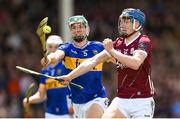 15 June 2024; Ciarán Leen of Galway is tackled by David Ryan of Tipperary during the Electric Ireland GAA Hurling All-Ireland Minor Hurling Championship semi-final match between Tipperary and Galway at TUS Gaelic Grounds in Limerick. Photo by Tom Beary/Sportsfile