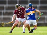 15 June 2024; Shane Ryan of Tipperary is tackled by Cillian Roche of Galway during the Electric Ireland GAA Hurling All-Ireland Minor Hurling Championship semi-final match between Tipperary and Galway at TUS Gaelic Grounds in Limerick. Photo by Tom Beary/Sportsfile