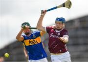 15 June 2024; Brian Callanan of Galway in action against Cathal O'Reilly of Tipperary during the Electric Ireland GAA Hurling All-Ireland Minor Hurling Championship semi-final match between Tipperary and Galway at TUS Gaelic Grounds in Limerick. Photo by Tom Beary/Sportsfile