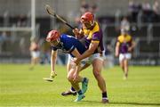 15 June 2024; Fiachra Fennell of Laois in action against Lee Chin of Wexford during the GAA Hurling All-Ireland Senior Championship preliminary quarter-final match between Laois and Wexford at Laois Hire O'Moore Park in Portlaoise, Laois. Photo by Matt Browne/Sportsfile