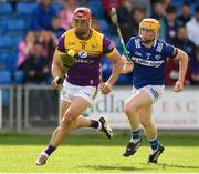 15 June 2024; Lee Chin of Wexford in action against Tom Cuddy  of Laois during the GAA Hurling All-Ireland Senior Championship preliminary quarter-final match between Laois and Wexford at Laois Hire O'Moore Park in Portlaoise, Laois. Photo by Matt Browne/Sportsfile