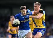 15 June 2024; Luke Fortune of Cavan in action against Ronan Daly of Roscommon during the GAA Football All-Ireland Senior Championship Round 3 match between Cavan and Roscommon at Glennon Brothers Pearse Park in Longford. Photo by Daire Brennan/Sportsfile
