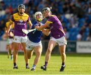 15 June 2024; Cian Byrne of Wexford in action against David Dooley of Laois during the GAA Hurling All-Ireland Senior Championship preliminary quarter-final match between Laois and Wexford at Laois Hire O'Moore Park in Portlaoise, Laois. Photo by Matt Browne/Sportsfile