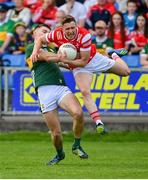 16 June 2024; Ryan Burns of Louth is tackled by Diarmuid O'Connor of Kerry during the GAA Football All-Ireland Senior Championship Round 3 match between Kerry and Louth at MW Hire O'Moore Park in Portlaoise, Laois. Photo by Tyler Miller/Sportsfile
