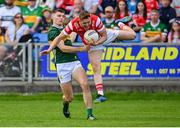 16 June 2024; Ryan Burns of Louth is tackled by Diarmuid O'Connor of Kerry during the GAA Football All-Ireland Senior Championship Round 3 match between Kerry and Louth at MW Hire O'Moore Park in Portlaoise, Laois. Photo by Tyler Miller/Sportsfile