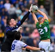 16 June 2024; Conor Gray of Meath in action against Monaghan goalkeeper Rory Beggan during the GAA Football All-Ireland Senior Championship Round 3 match between Monaghan and Meath at Kingspan Breffni in Cavan. Photo by Ben McShane/Sportsfile