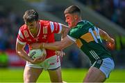 16 June 2024; Dan Corcoran of Louth in action against Seán O'Shea of Kerry during the GAA Football All-Ireland Senior Championship Round 3 match between Kerry and Louth at MW Hire O'Moore Park in Portlaoise, Laois. Photo by Tyler Miller/Sportsfile