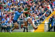 16 June 2024; Aidan O'Shea of Mayo is tackled by Colm Basquel of Dublin during the GAA Football All-Ireland Senior Championship Round 3 match between Dublin and Mayo at Dr Hyde Park in Roscommon. Photo by Ray McManus/Sportsfile