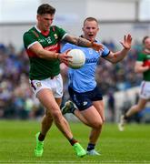 16 June 2024; Jordan Flynn of Mayo is tackled by Ciaran Kilkenny of Dublin during the GAA Football All-Ireland Senior Championship Round 3 match between Dublin and Mayo at Dr Hyde Park in Roscommon. Photo by Ray McManus/Sportsfile