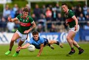 16 June 2024; Michael Fitzsimons of Dublin in action against Jordan Flynn, left, and Stephen Coen of Mayo during the GAA Football All-Ireland Senior Championship Round 3 match between Dublin and Mayo at Dr Hyde Park in Roscommon. Photo by Ray McManus/Sportsfile
