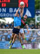 16 June 2024; Brian Howard of Dublin in action against Jordan Flynn of Mayo during the GAA Football All-Ireland Senior Championship Round 3 match between Dublin and Mayo at Dr Hyde Park in Roscommon. Photo by Daire Brennan/Sportsfile