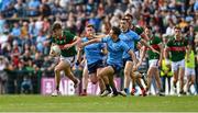 16 June 2024; Rory Brickenden of Mayo in action against Michael Fitzsimons of Dublin during the GAA Football All-Ireland Senior Championship Round 3 match between Dublin and Mayo at Dr Hyde Park in Roscommon. Photo by Daire Brennan/Sportsfile