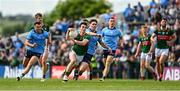 16 June 2024; Jack Coyne of Mayo in action against Michael Fitzsimons of Dublin during the GAA Football All-Ireland Senior Championship Round 3 match between Dublin and Mayo at Dr Hyde Park in Roscommon. Photo by Daire Brennan/Sportsfile