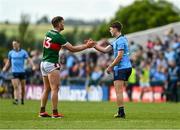 16 June 2024; Michael Fitzsimons of Dublin shakes hands with Aidan O'Shea of Mayo after the GAA Football All-Ireland Senior Championship Round 3 match between Dublin and Mayo at Dr Hyde Park in Roscommon. Photo by Daire Brennan/Sportsfile