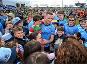 16 June 2024; Brian Fenton of Dublin with supporters after the GAA Football All-Ireland Senior Championship Round 3 match between Dublin and Mayo at Dr Hyde Park in Roscommon. Photo by Daire Brennan/Sportsfile