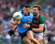 16 June 2024; Colm Basquel of Dublin is tackled by Aidan O'Shea of Mayo during the GAA Football All-Ireland Senior Championship Round 3 match between Dublin and Mayo at Dr Hyde Park in Roscommon. Photo by Ray McManus/Sportsfile