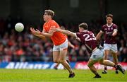 16 June 2024; Andrew Murnin of Armagh in action against Cathal Sweeney of Galway during the GAA Football All-Ireland Senior Championship Round 3 match between Armagh and Galway at Markievicz Park in Sligo. Photo by Brendan Moran/Sportsfile