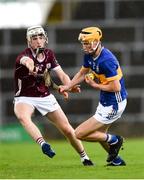 15 June 2024; Eoghan Doughan of Tipperary in action against Jamie Ryan of Galway during the Electric Ireland GAA Hurling All-Ireland Minor Hurling Championship semi-final match between Tipperary and Galway at TUS Gaelic Grounds in Limerick. Photo by Tom Beary/Sportsfile